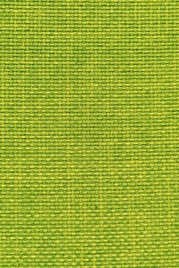 Kadife yeşili kumaşın dokusu. Döşeme mobilyalarının kumaş dokusu tekstil malzemesi, iç tasarım, duvar dekoru. Kumaş dokusu yakın çekim, dikey fotoğraf