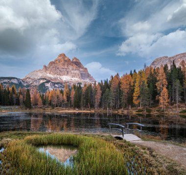 Beautiful autumn evening Lake Antorno and Three Peaks of Lavaredo (Lago Di Antorno and Tre Cime di Lavaredo), Dolomites, Italy. Picturesque traveling, seasonal and nature beauty concept scene.