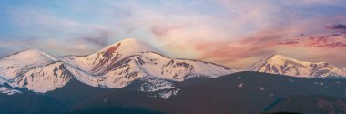 Sunrise landscape in spring Carpathian mountains, Ukraine, Europe. High-resolution extra wide panorama multi shots stitch image of Chornohora ridge from Pozhezhevska to Hoverla and Petros mountains.