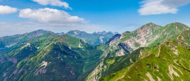 Tatra Mountain (Poland) view from Kasprowy Wierch range. Summer morning panorama. People are unrecognizable.