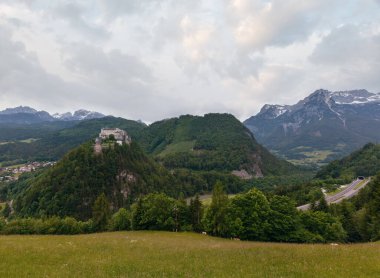 Alps mountain castle summer view (Austria, Hohenwerfen Castle, was built between 1075 and 1078) clipart