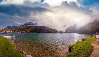 Mountain alpine autumn misty morning lake Konigssee, Schonau am Konigssee, Berchtesgaden national park, Bavaria, Germany. Picturesque traveling, seasonal and nature beauty concept scene. clipart