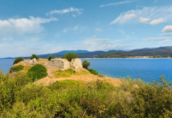 stock image Summer sea coast landscape with old ruins of Ancient City Toroni fort (Halkidiki, Sithonia, Greece).