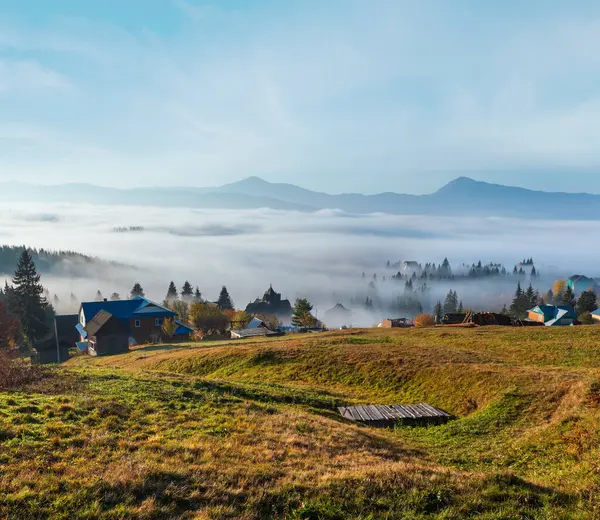 stock image Morning fog on the slopes of the Carpathian Mountains (Yablunytsia village, Ivano-Frankivsk oblast, Ukraine). Autumn rural landscape.