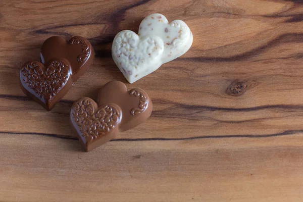 Heart Shaped Chocolates Wooden Table Close — Φωτογραφία Αρχείου