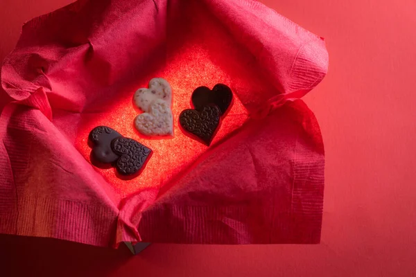 Heart Shaped Chocolates Glowing Box Red Background — Fotografia de Stock
