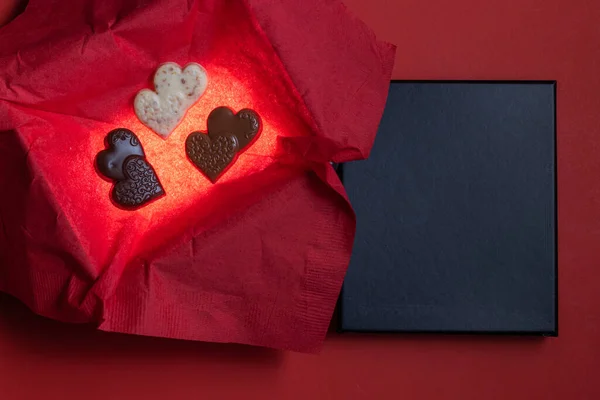 Heart Shaped Chocolates Glowing Box Red Background Black Lid Text — Foto de Stock