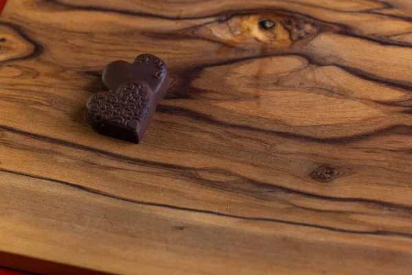 Heart Shaped Chocolates Wooden Table Close — Φωτογραφία Αρχείου