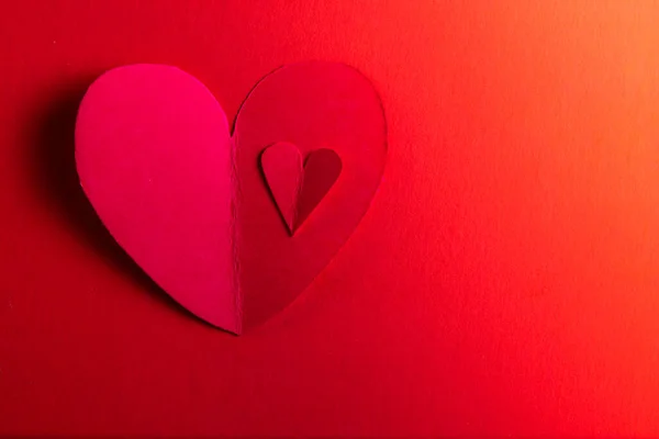 Hand Cut Hearts Out Red Paper Red Background — Stock fotografie