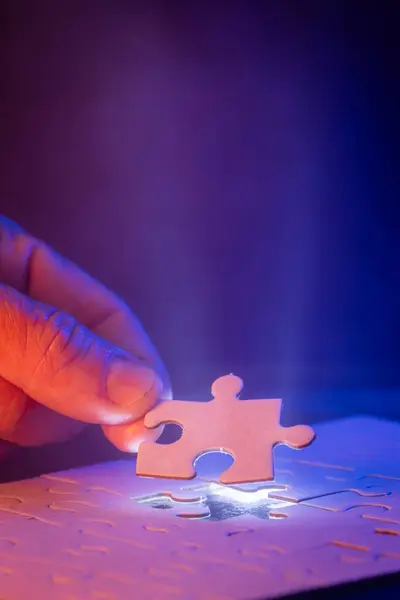 Close Hand Holding Missing Puzzle Piece Glow Showing Piece Goes — Stock Photo, Image