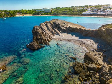 Areal drone view of beautiful bay and Arenal d'en Castell beach on Menorca island, Spain clipart