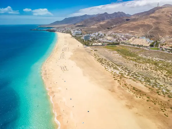 stock image White sandy beach and blue water in Morro Jable, south of Fuerteventura, Canary islands, Spain