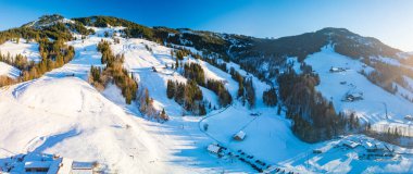 The Neusell ski area and village in winter, Rothenthurm, Biberegg - Canton of Schwyz, Switzerland clipart