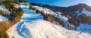 The Neusell ski area and village in winter, Rothenthurm, Biberegg - Canton of Schwyz, Switzerland clipart