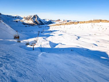 Ski slopes and mountains, Melchsee-Frutt mountain resort village, Switzerland in winter clipart