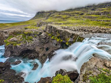 Vibrant view of waterfall Nykurhylsfoss Sveinsstekksfoss, east Iceland clipart