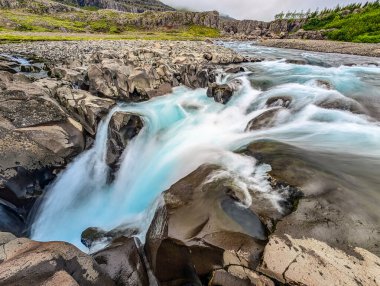 Vibrant view of waterfall Nykurhylsfoss Sveinsstekksfoss, east Iceland clipart