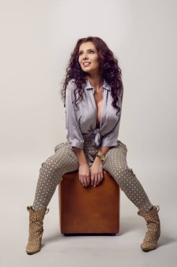 beautiful young woman fashion photo on gray background