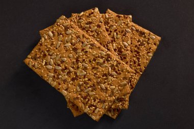 crunchy eco snack made from whole wheat flour and three types of seeds .