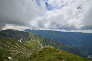 Landscape with the Fagarasi mountains in Romania on a summer day. clipart