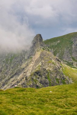 Landscape with the Fagarasi mountains in Romania on a summer day. clipart