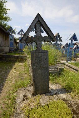 Sapanta Romania July 14, 2024. The Vesel Cemetery is a cemetery in Sapanta Maramures County, famous for its brightly colored grave crosses and naive paintings representing scenes from life. clipart