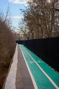 picture of a child on a bike path during the day clipart