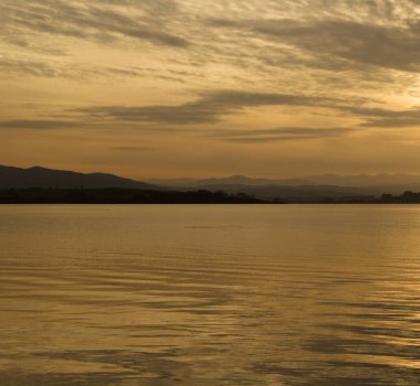 Cantabria, Bay of Santander, evening light seen from the water level clipart