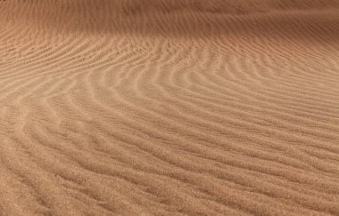 natural sand pattern created by wind blowing differently sized and colored particles clipart