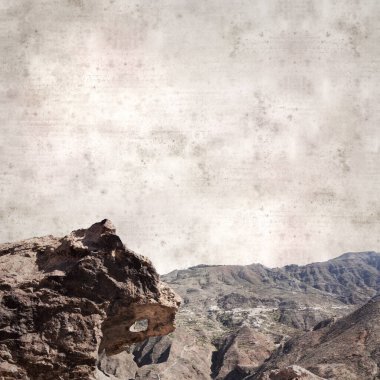 textured stylish old paper background, square, with landscape of Gran Canaria, around the Dog of Bentayga rock formation  clipart