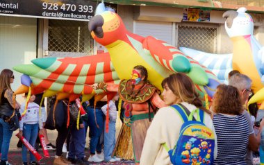 Las Palmas de Gran Canaria, Spain - January 5 2025: Tourists and locals enjoy Cavalcade of Magi, a traditional parade with Three Magi on Epiphany's eve clipart