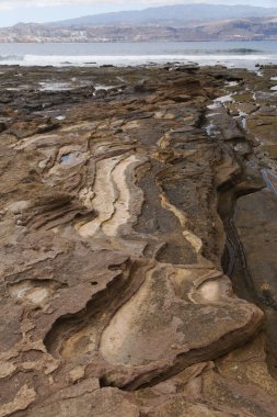 Gran Canaria, textures of the rocks of El Confital beach on the edge of Las Palmas de Gran Canaria, low tide