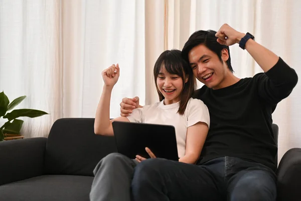 Overjoyed Asian Couple Looking Digital Tablet Celebrating Achieve Getting Good — Stock Photo, Image