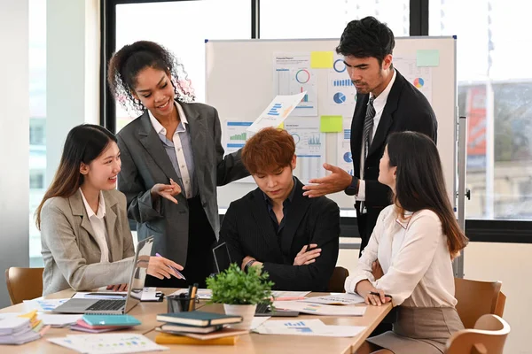 stock image Group of businesspeople talking, brainstorming on start up project together at office meeting.