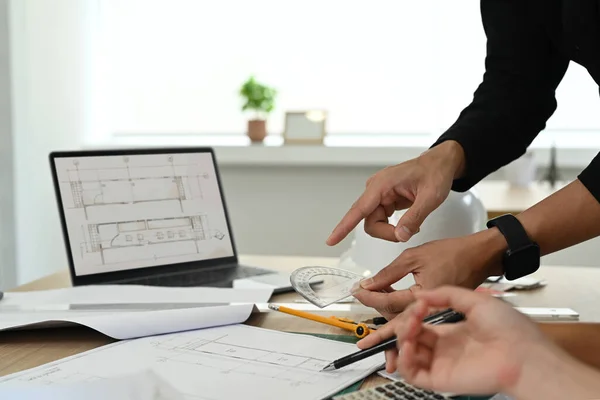 stock image Engineer or architect team brainstorming, planning development details at construction office.