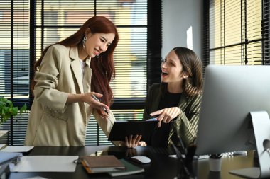 Two professional business people discussing project developing financial research together at modern office.