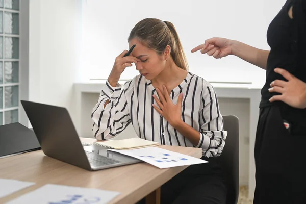 Stressed woman gets scolding from angry irritated company boss. Emotional pressure, stress at work.