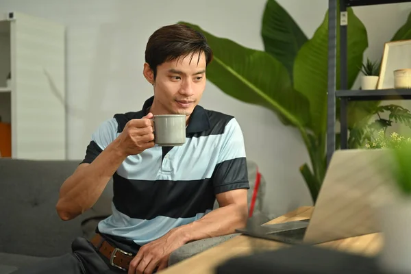 Attractive Asian Man Drinking Coffee Remind Email Laptop While Working — Fotografia de Stock
