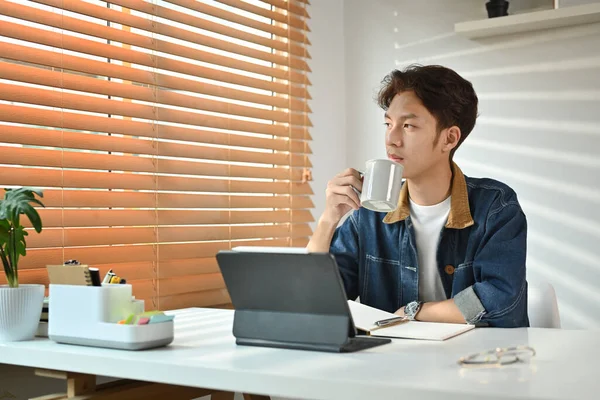 Thoughtful Young Asian Man Drinking Coffee Looking Window Pondering Idea — Φωτογραφία Αρχείου