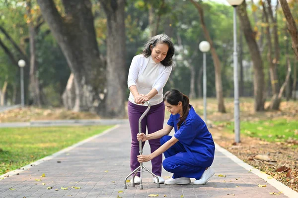 Attentive Female Caregiver Helping Teaching Senior Woman Walking Walker Assistance — Stock Photo, Image