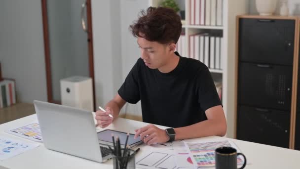 Young Man Web Designer Using Digital Tablet Working Mobile Application — Stock Video