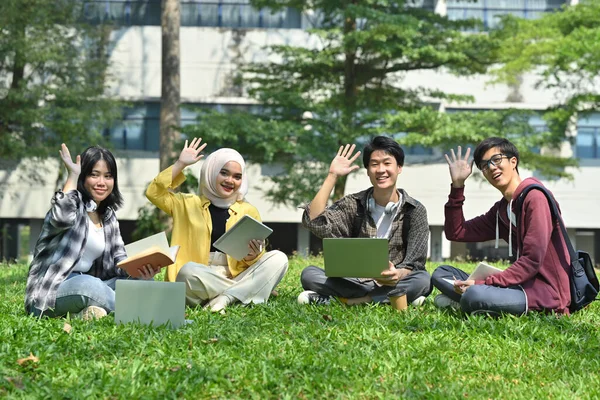 Group Young Students Sitting University Building Waving Hands Camera Youth — Stock Photo, Image
