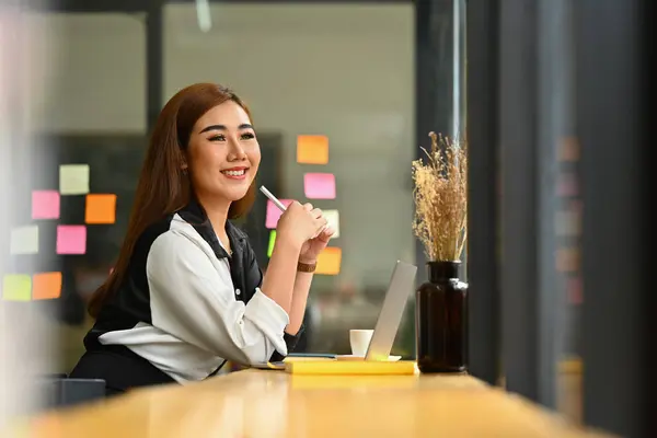 Smiling Millennial Woman Entrepreneur Sitting Wooden Counter Office Looking Window — Stock Photo, Image