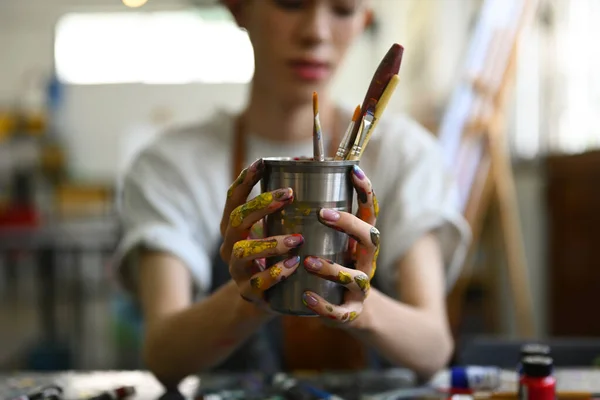 Stock image Art, education, creativity and people concept. Asian student man painting on canvas with watercolors at art class.