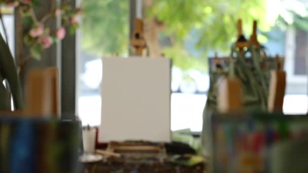 Empty Artist Canvas Wooden Easel Paint Brushes Window Bright Art — Vídeo de Stock