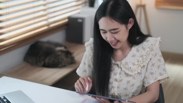 Satisfied Young Woman Freelancer Using Stylus Pen Writing Digital Tablet — Stock Video