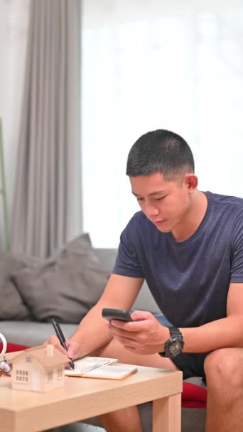 Handsome Millennial Man Using Smart Phone Making Online Payments Managing — Stock Video