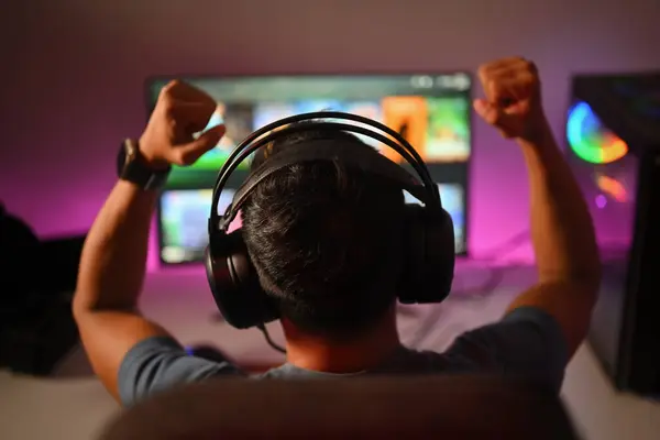 Back View Professional Gamer Wearing Headphones Celebrating Victory While Playing — Stock Photo, Image