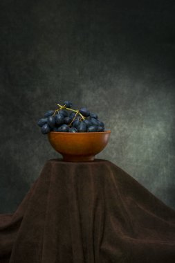Still life with a bunch of ripe grapes close-up