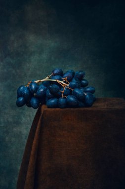 Still life with a bunch of ripe grapes close-up